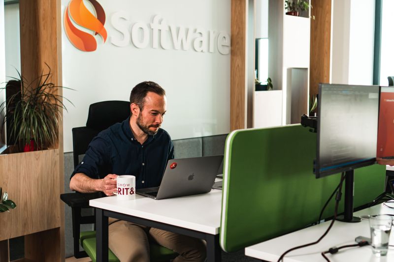 Employee working on computer in Software Mind office